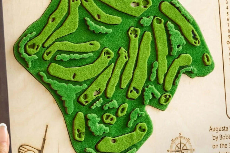 Green golf course design on a wooden board with branding details.