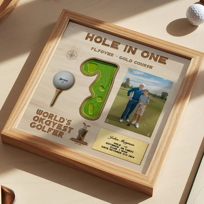 Framed golf-themed artwork with a wooden border, golf ball, and golfer photo.