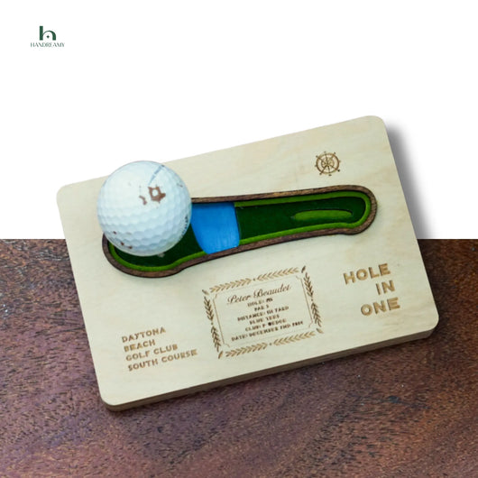 Wooden plaque with golf ball and golf club on a wooden surface