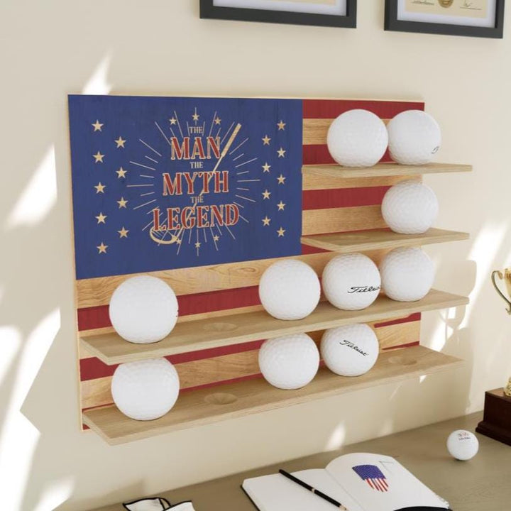 Wooden shelf with golf balls against a wall with a decorative American flag design.