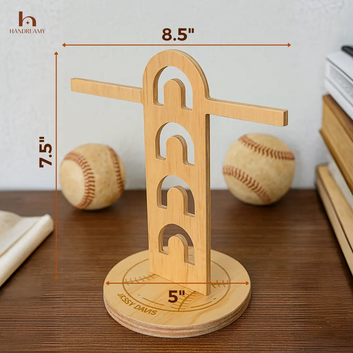 Wooden baseball bat stand with measurements and baseballs in the background