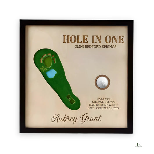 Framed golf plaque with 'Hole in One' details on a beige background