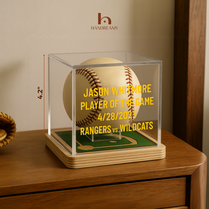 Baseball in a clear display case with personalized text on a wooden surface, featuring the Handreamy brand.