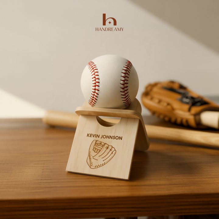 Baseball on a wooden stand with a personalized engraving, set against a neutral background.