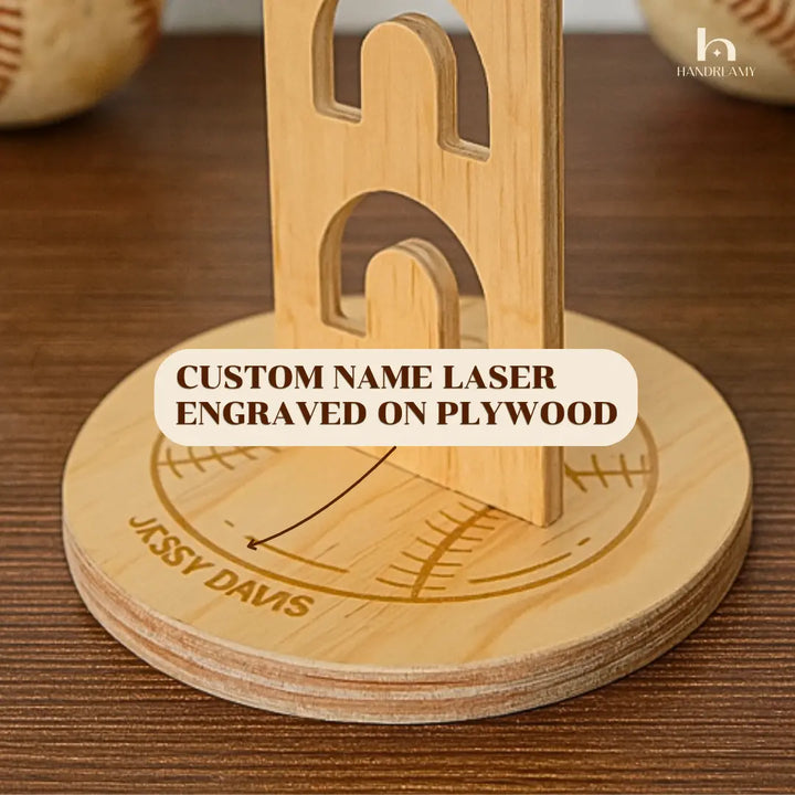 Wooden coaster set with engraved name on a wooden surface