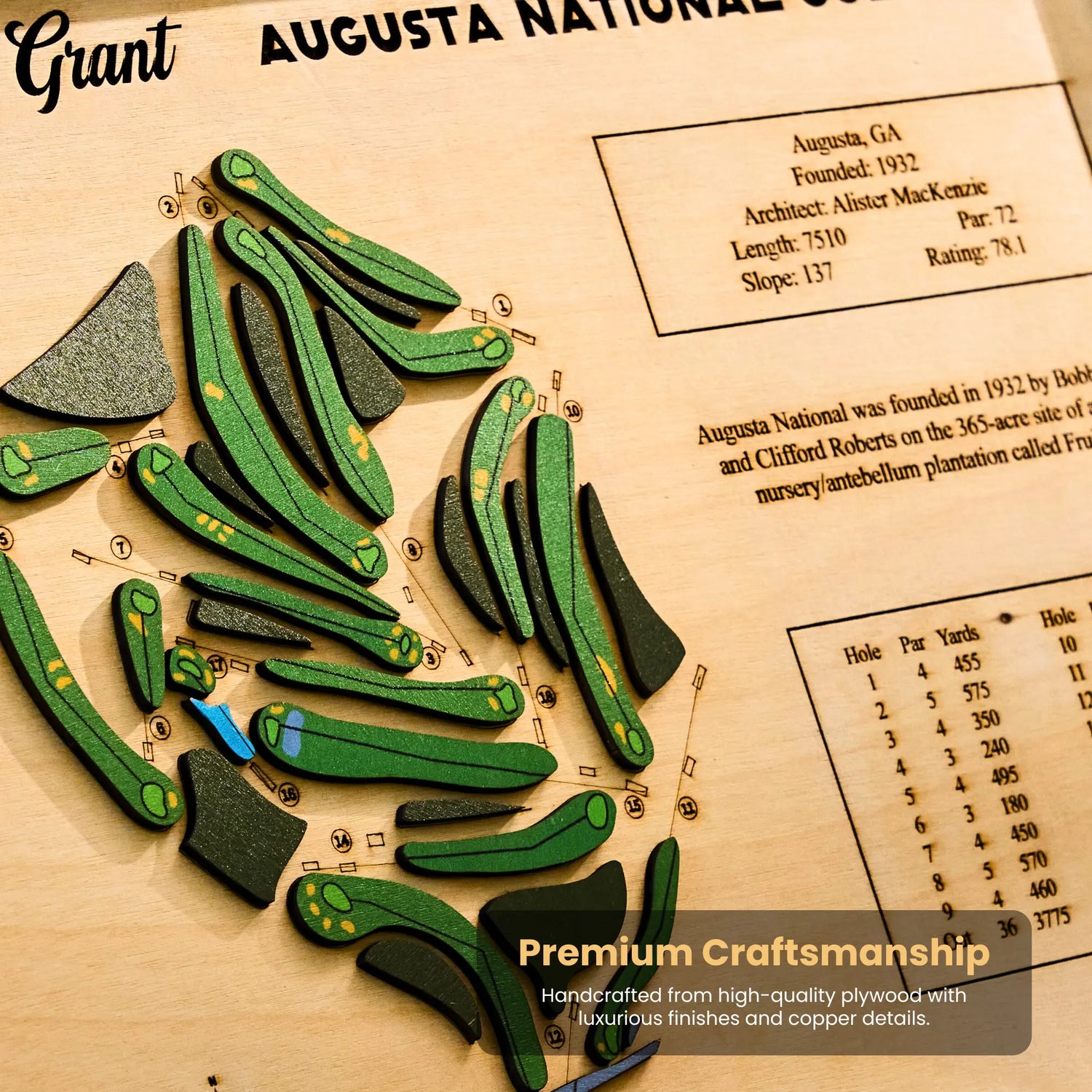 Wooden golf course model with detailed layout on a wooden board, featuring branding and craftsmanship text.