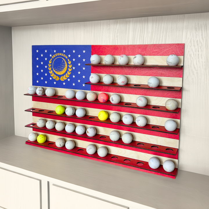 Golf ball display rack with American flag design on a wall.