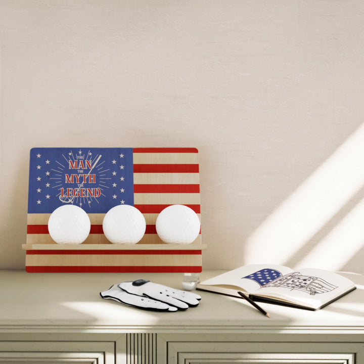 American flag-themed light fixture on a shelf with a glove and notebook.