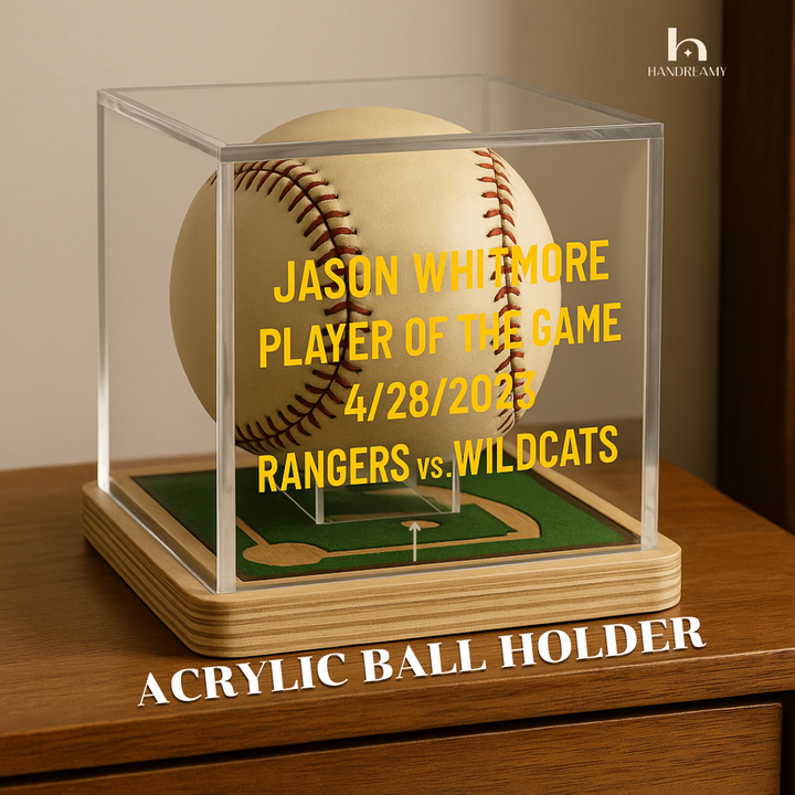 Baseball in an acrylic holder with personalized text on a wooden surface