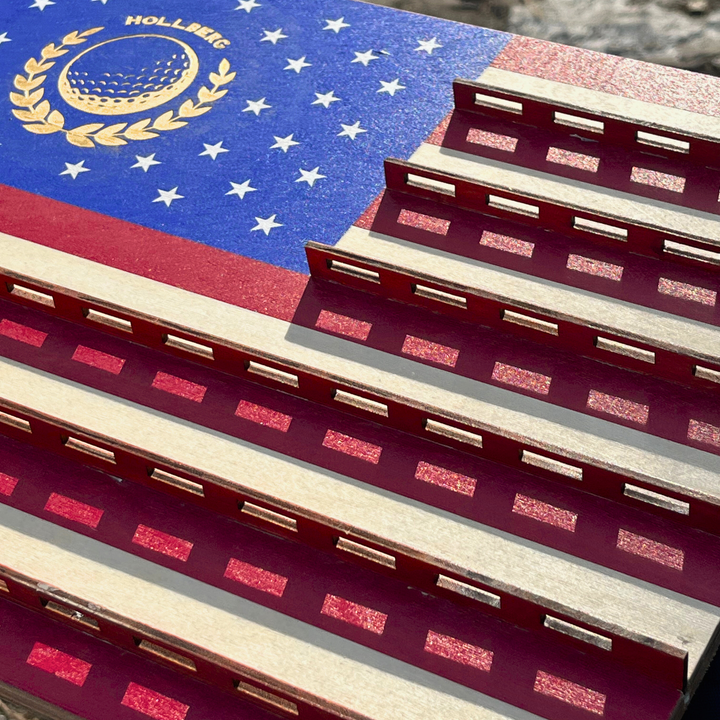 Close-up of a product with a design resembling the American flag and golf ball emblem.