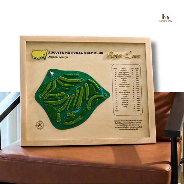 Framed map of Augusta National Golf Club with green layout and wooden border.