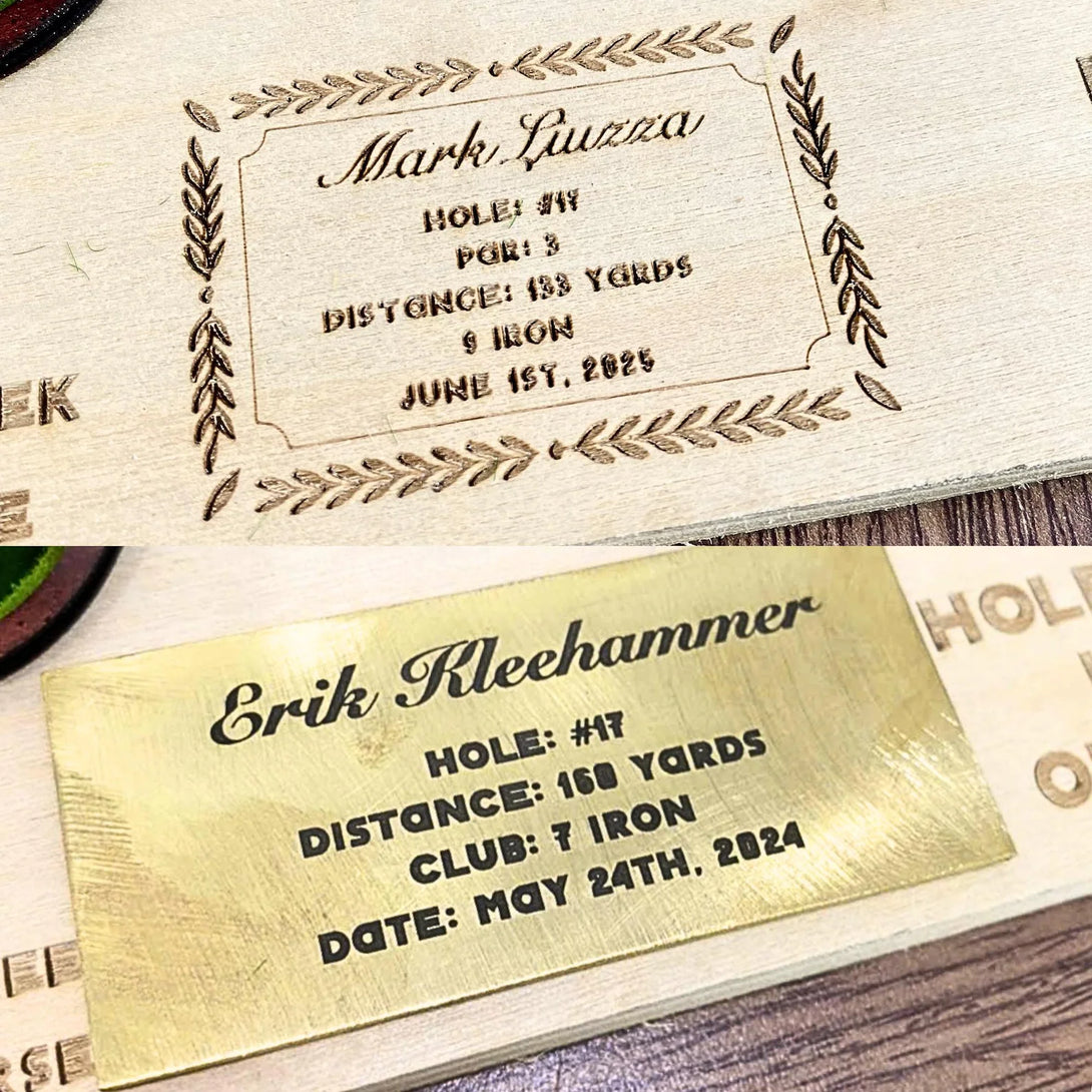 Two engraved metal golf scorecards with personalized details on a wooden surface.